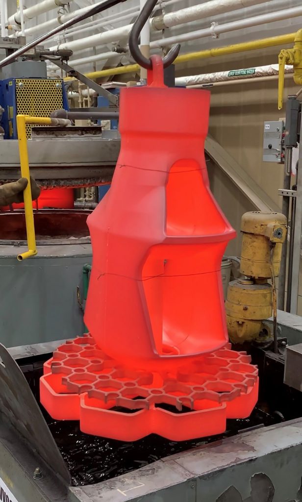Image of a muzzle brake as it undergoes heat treatment
